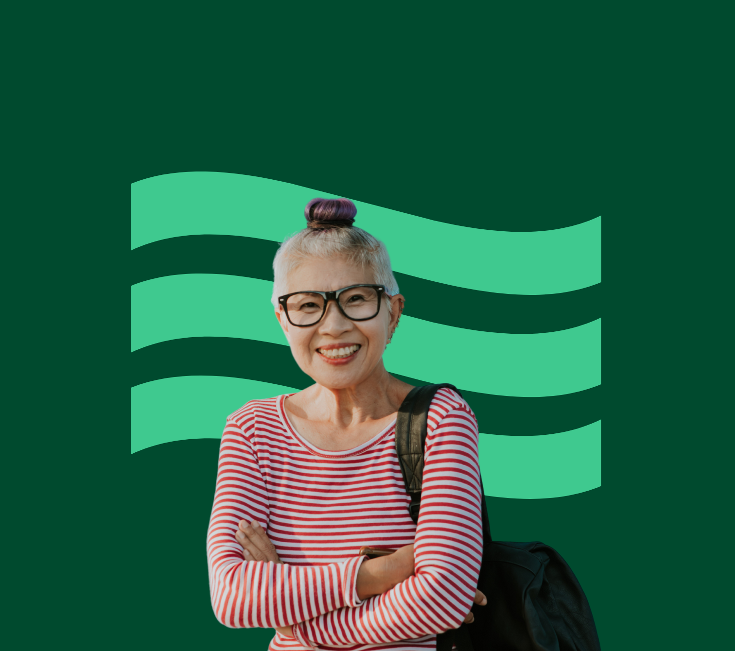 An Asian woman wearing a red and white striped shirt smiles in front of a green flag.