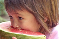 Little girl eating watermelon