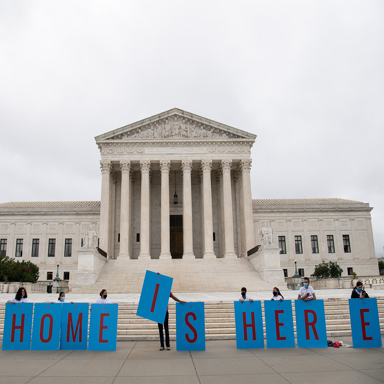 Activists hold a banner in front of the US Supreme Court in Washington, DC, on June 18, 202